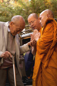 Two monks from Thailand, who attended our introductory course, making offering prayers to Rinpoche.